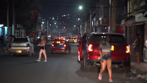 Prostitutes sitting and looking for clients at night Stock Footage 107208678