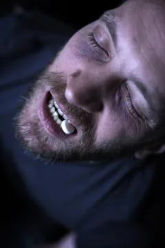 Prostrate junky getting heroin dose on the street Stock Photos