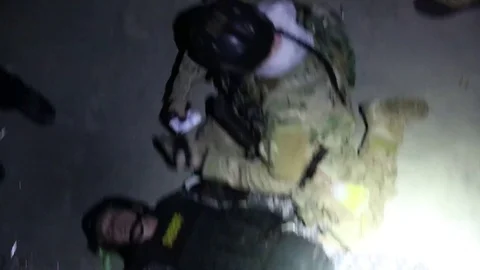 Prostrate SWAT Member Acts Wounded in Training Exercise Stock Footage 70562537