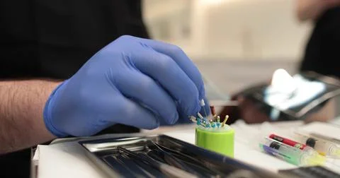 Protaper needles that a nurse prepares for use by a doctor in dentistry. Stock Photos