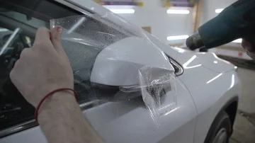 Protection of the car with polypropylene Stock Footage 85901943