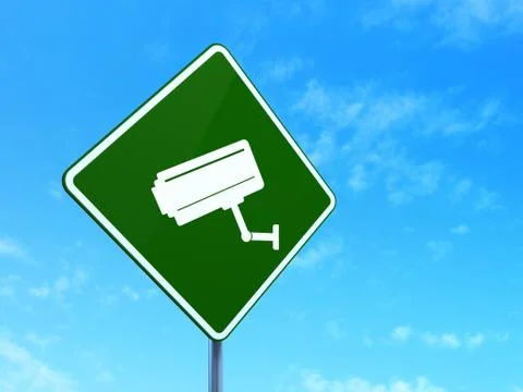 Protection concept: Cctv Camera on road sign background Illustrazione stock