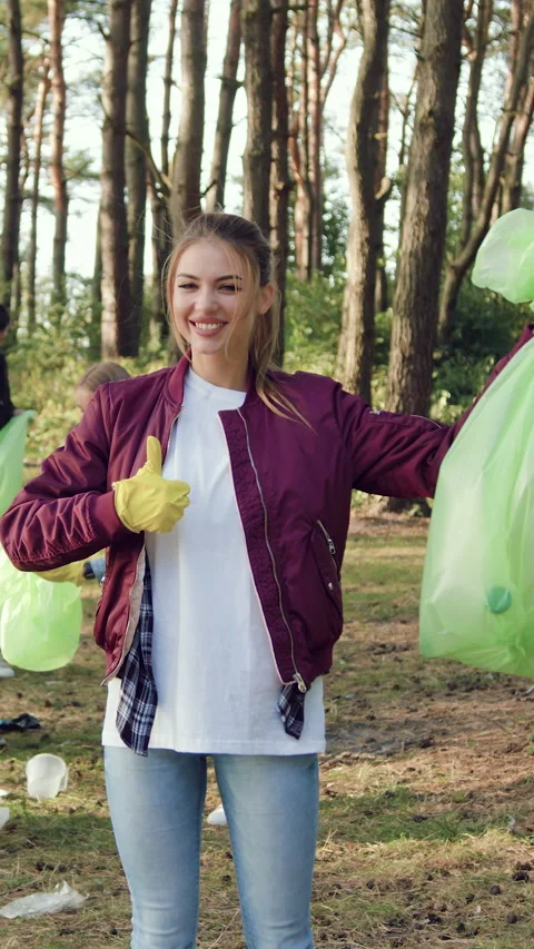 Protection of environment concept where adorable cheerful girl with plastic bag  Stock Footage 325344129