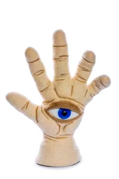 Protective amulet in the shape of an open palm and eye made of felted wool Stock Photos
