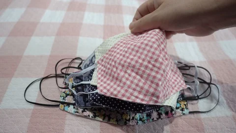 Protective cotton mask counting for donations. Mask shortage. Stock Footage 128273699