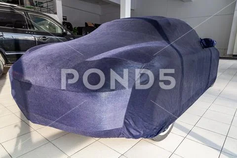 Protective cover awning for cars, blue, made from special material, bespoke a Stock Photos