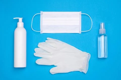 Protective equipment for prevention of virus infection on blue background Stock Photos