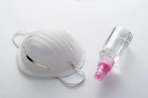 Protective face mask and hand sanitizer Stock Photos
