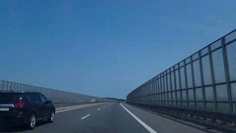 Protective fence along the freeway. Dust, wind, road noise insulation Stock Footage 275334844