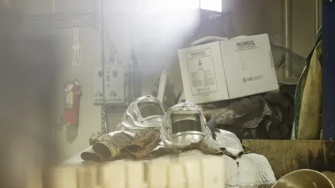 Protective gear sitting in foundry Stock Footage 105972319