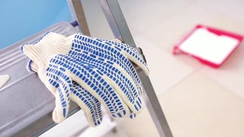 Protective gloves and paint on the background of repair Stock Footage 75048628