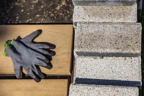 Protective gloves for a bricklayer, placed on a granite block, personal pro.. Stock Photos