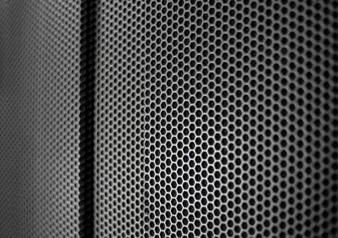 Protective grid close-up of an amplifier as a wallpaper Stock Photos