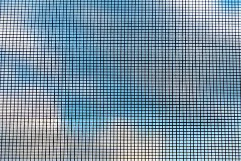 Protective insect net against the sky. Beautiful background Stock Photos