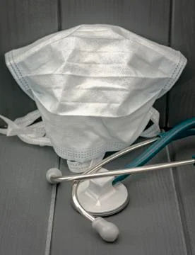 Protective mask and stethoscope. Basic hospital medical equipment to fight vi Stock Photos