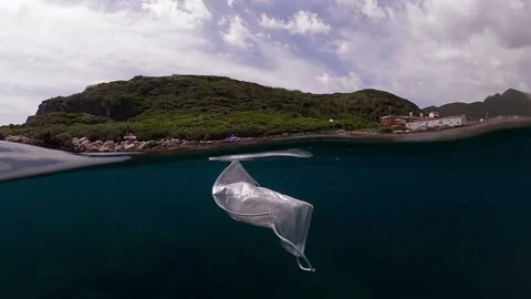 Protective mask discarded and thrown on the ocean. Abandoned facemask-Dan Stock Footage 134281264