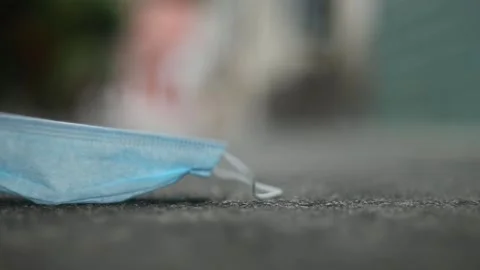 Protective mask falling on the ground Stock Footage 158586467