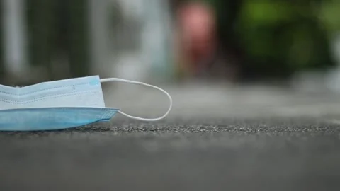Protective mask falling on the ground Stock Footage 158586518