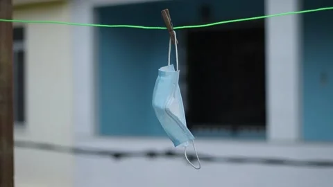 Protective mask hanging on the clothesline Stock Footage 158586538