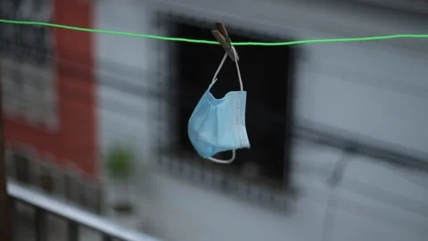 Protective mask hanging on the clothesline Stock Footage 158586559