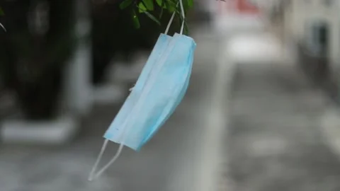 Protective mask hanging on the tree Stock Footage 158586511