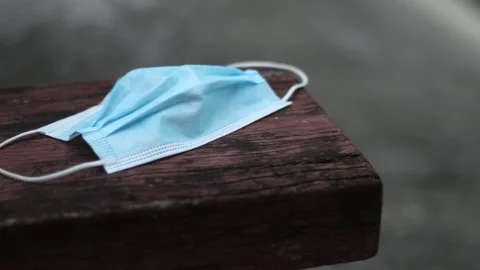 Protective mask on top of a bench Stock Footage 158586553