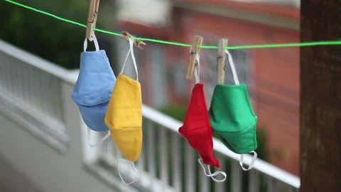Protective masks hanging on the clothesline Stock Footage 158586462