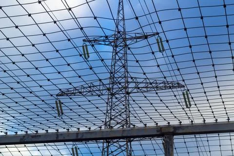 Protective mesh under the high-voltage line, safety and maintenance of power  Stock Photos