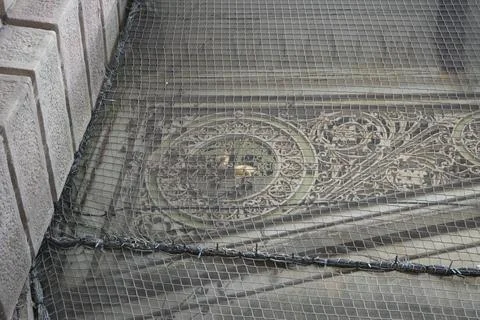 Protective Net Over Ornate Architectural Details In Derby, England Stock Photos