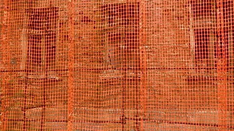 Protective net standing in front of the old building. Video stock 157062520
