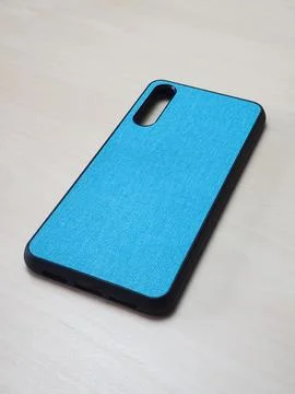 Protective phone case made of dense material with rubber edges. Stock Photos