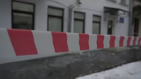 Protective red and white stripped tape stretched on city street Stock Footage 235148518