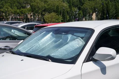 Protective reflective surface under windshield of car on hot day, heated by sun 写真素材