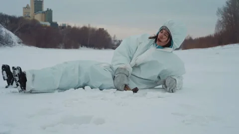 Protective researcher succumbs in winter environment. Research specialist in Stock Footage 346471430