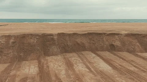 Protective sand wall stands across Newport Beach shoreline as a defense 스톡 동영상 347744490