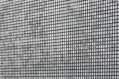 Protective screen metal rectangular plates with rivets on the facade. Foto stock