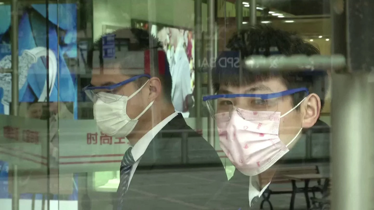 Protective Suits And Masks: Chinese Returning To Work Grapple With Coronav... Stock Footage