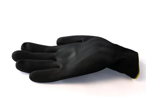 Protective work glove isolated on white background. Stock Photos