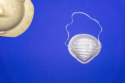 Protective worker gloves on a blue background Stock Photos
