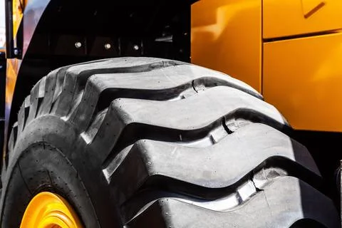 Protector of a large rubber wheel. Huge rubber tire career dump trucks, mining 写真素材