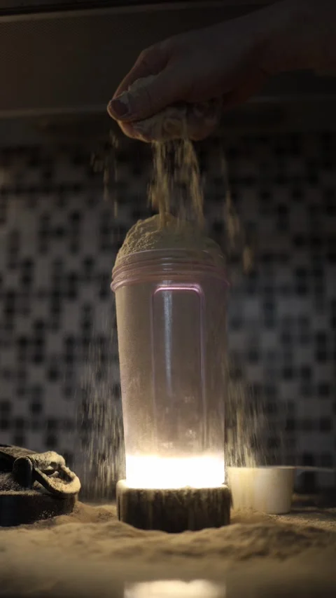 Protein powder overflow in shaker Stock Footage 329449373