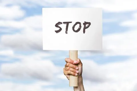 Protest banner on cloudy sky background Stock Photos