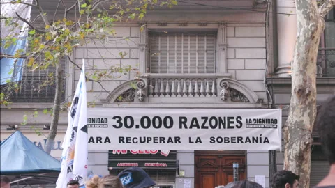 Protest banner referencing the number of disappeared on truth day Stock Footage 318267783