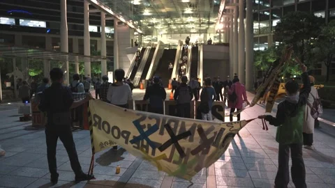 Protest banner waves in the wind against the 2020 Tokyo Olympics - 4K Stock Footage 154898113