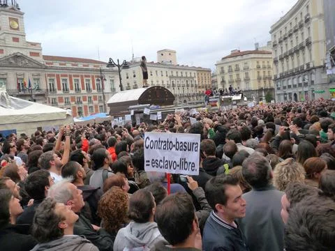 Protest banners and protesters on top of kiosks Stock Photos