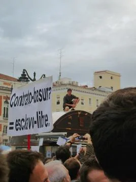 Protest banners and protesters on top of kiosks Stock Photos