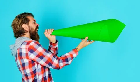 Protest. Bearded man shouting in paper loudspeaker. Own opinion. Freedom of s Stock Photos