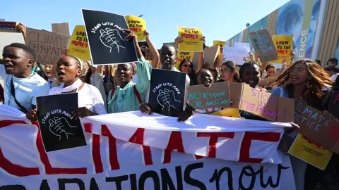 Protest calls for climate change solutions to world leaders at COP27, Sharm El S Stock Footage 221030459
