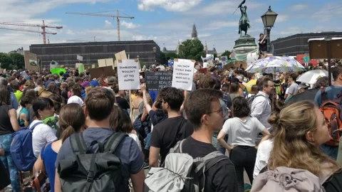 Protest crowds gather at climate justice for environmental policy demo Vienna 4K Stock Footage 133657785