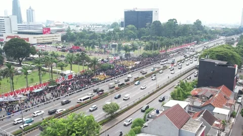 PROTEST AT INDONESIAN PARLEMENT BECAUSE SUDDENLY CHANGES OF ELECTION LAW Video stock 282574353